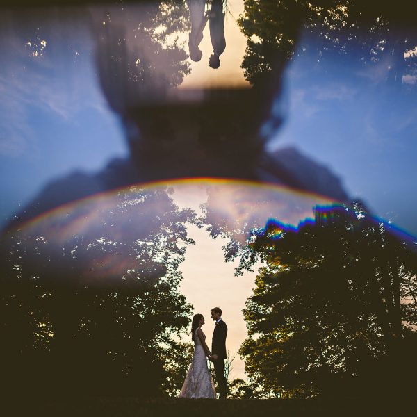 creative reflected wedding portrait in prism