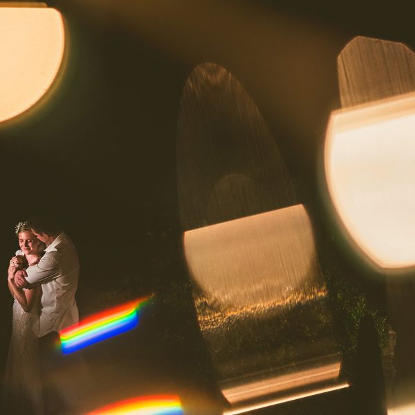 Vermont barn wedding night portrait with string lights