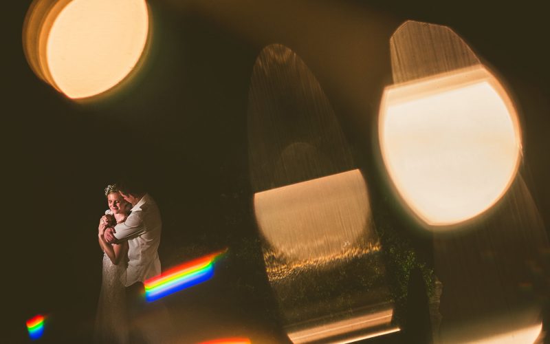 Vermont barn wedding night portrait with string lights